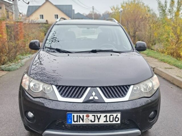 Черный Мицубиси Аутлендер, объемом двигателя 2 л и пробегом 226 тыс. км за 4700 $, фото 2 на Automoto.ua