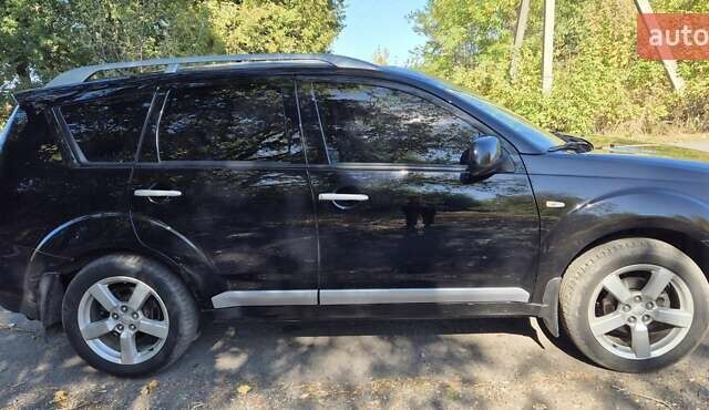 Черный Мицубиси Аутлендер, объемом двигателя 2.4 л и пробегом 178 тыс. км за 9150 $, фото 5 на Automoto.ua