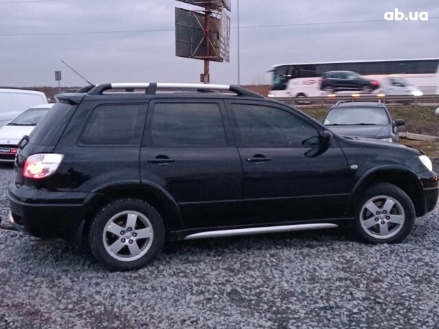 Черный Мицубиси Аутлендер, объемом двигателя 2 л и пробегом 271 тыс. км за 6940 $, фото 9 на Automoto.ua