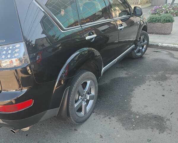 Черный Мицубиси Аутлендер, объемом двигателя 2.36 л и пробегом 245 тыс. км за 9200 $, фото 9 на Automoto.ua