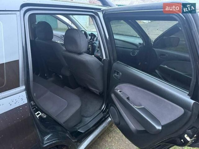Черный Мицубиси Аутлендер, объемом двигателя 2 л и пробегом 232 тыс. км за 7000 $, фото 7 на Automoto.ua