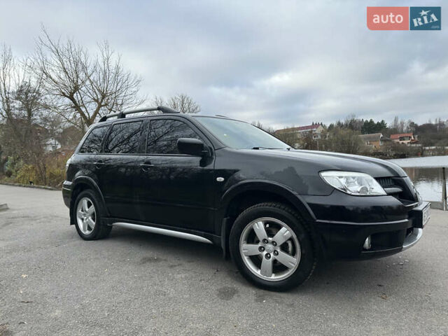Чорний Міцубісі Аутлендер, об'ємом двигуна 2 л та пробігом 118 тис. км за 8100 $, фото 7 на Automoto.ua