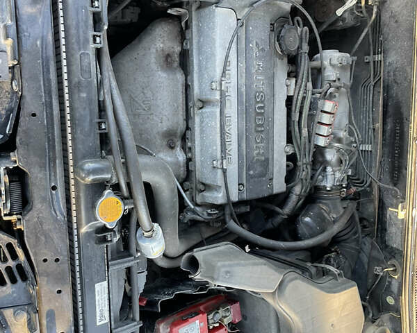 Чорний Міцубісі Аутлендер, об'ємом двигуна 2 л та пробігом 218 тис. км за 6300 $, фото 10 на Automoto.ua