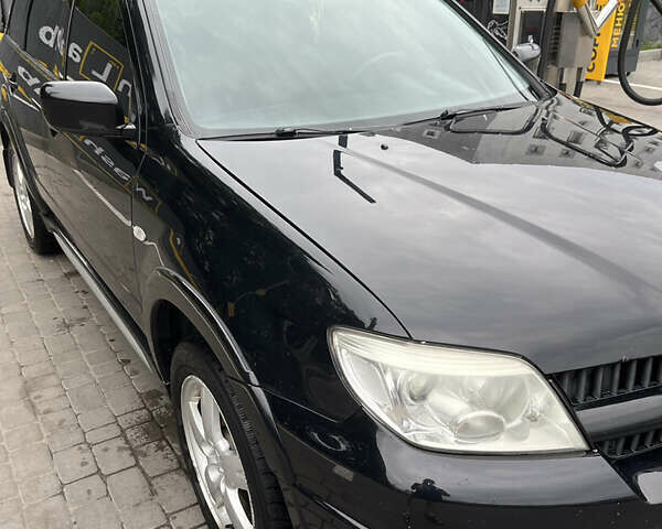 Чорний Міцубісі Аутлендер, об'ємом двигуна 2.38 л та пробігом 218 тис. км за 8300 $, фото 5 на Automoto.ua