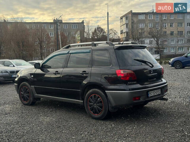 Черный Мицубиси Аутлендер, объемом двигателя 2 л и пробегом 240 тыс. км за 5500 $, фото 3 на Automoto.ua