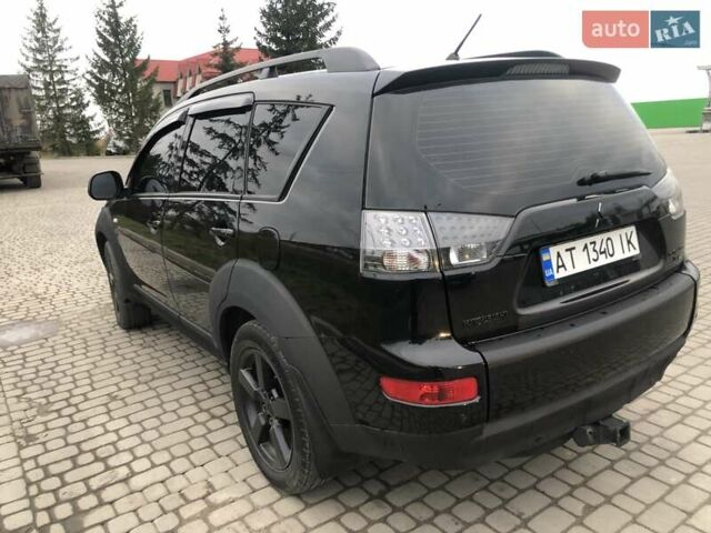 Чорний Міцубісі Аутлендер, об'ємом двигуна 2.4 л та пробігом 199 тис. км за 8999 $, фото 2 на Automoto.ua