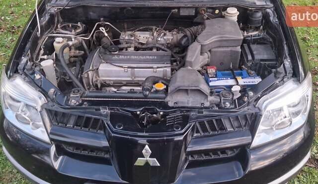Міцубісі Аутлендер 2008 у Галиче на Automoto.ua Чорний Міцубісі Аутлендер, об'ємом двигуна 2 л та пробігом 112 тис. км за 7350 $, фото 16 на Automoto.ua