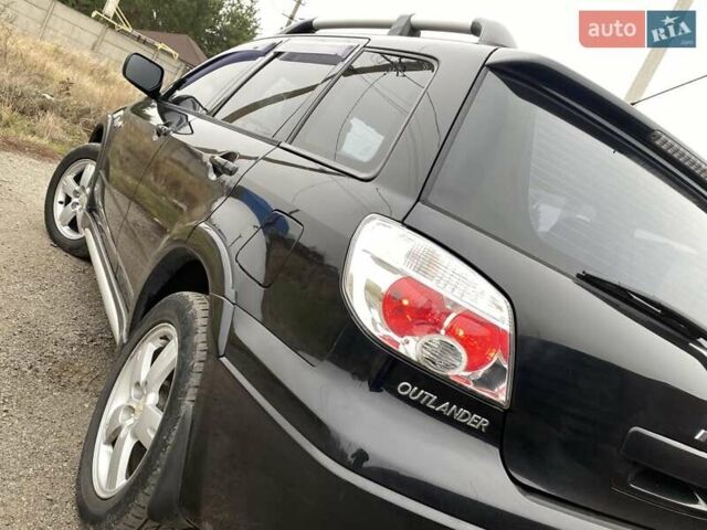 Черный Мицубиси Аутлендер, объемом двигателя 2.4 л и пробегом 178 тыс. км за 6900 $, фото 15 на Automoto.ua