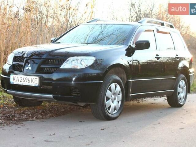 Черный Мицубиси Аутлендер, объемом двигателя 2 л и пробегом 189 тыс. км за 7200 $, фото 5 на Automoto.ua