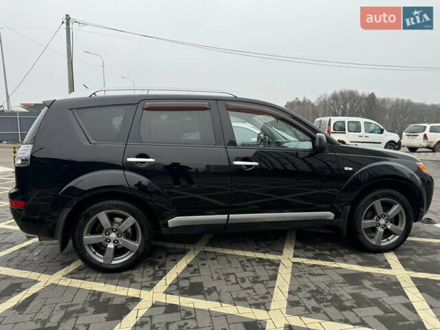 Черный Мицубиси Аутлендер, объемом двигателя 2.36 л и пробегом 120 тыс. км за 10100 $, фото 6 на Automoto.ua