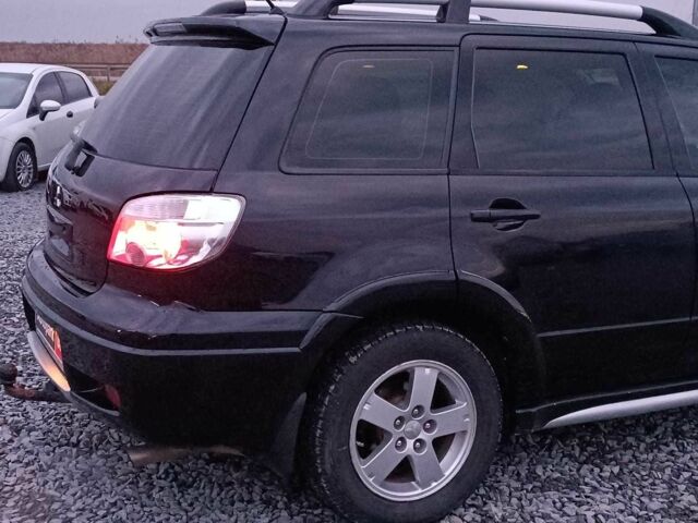 Черный Мицубиси Аутлендер, объемом двигателя 2 л и пробегом 271 тыс. км за 6940 $, фото 8 на Automoto.ua