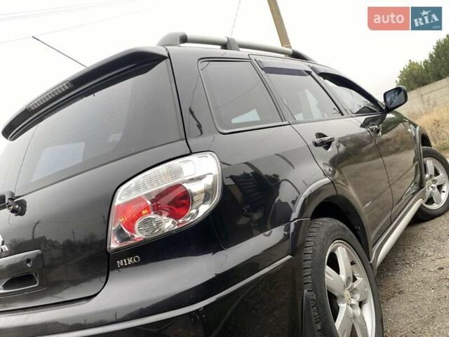 Черный Мицубиси Аутлендер, объемом двигателя 2.4 л и пробегом 178 тыс. км за 6900 $, фото 25 на Automoto.ua