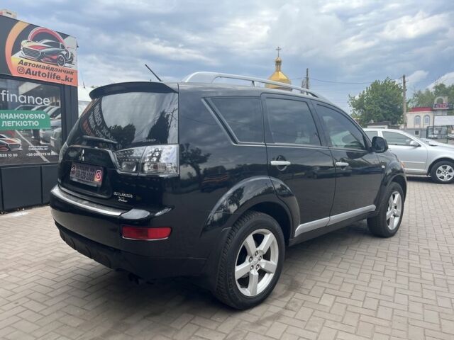 Черный Мицубиси Аутлендер, объемом двигателя 3 л и пробегом 235 тыс. км за 9800 $, фото 3 на Automoto.ua
