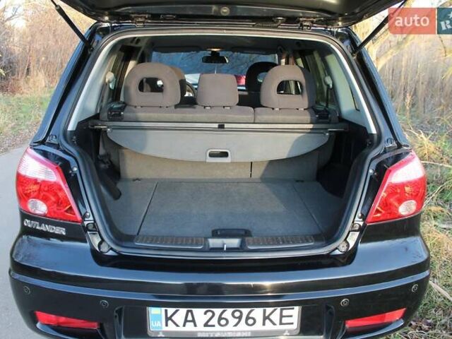 Черный Мицубиси Аутлендер, объемом двигателя 2 л и пробегом 190 тыс. км за 6900 $, фото 46 на Automoto.ua