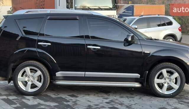 Чорний Міцубісі Аутлендер, об'ємом двигуна 2.4 л та пробігом 230 тис. км за 9700 $, фото 3 на Automoto.ua