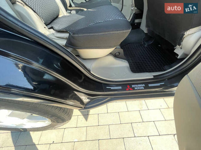 Чорний Міцубісі Аутлендер, об'ємом двигуна 2.4 л та пробігом 195 тис. км за 8600 $, фото 8 на Automoto.ua