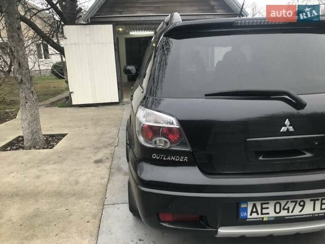 Чорний Міцубісі Аутлендер, об'ємом двигуна 2.38 л та пробігом 207 тис. км за 7000 $, фото 6 на Automoto.ua