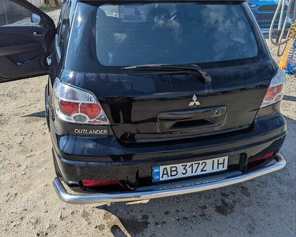 Черный Мицубиси Аутлендер, объемом двигателя 2 л и пробегом 189 тыс. км за 7100 $, фото 8 на Automoto.ua