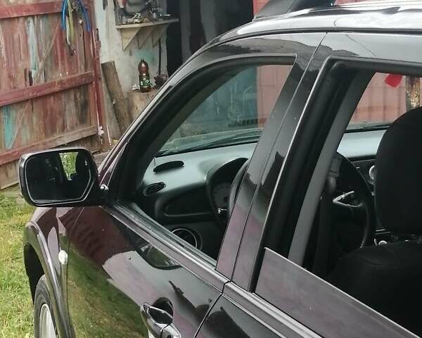 Чорний Міцубісі Аутлендер, об'ємом двигуна 2 л та пробігом 208 тис. км за 6700 $, фото 1 на Automoto.ua