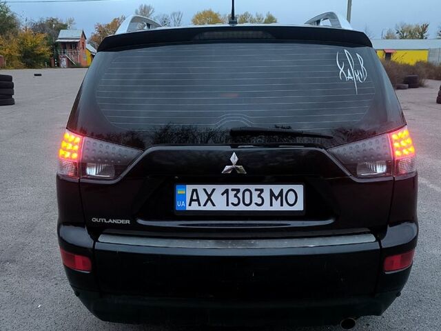 Черный Мицубиси Аутлендер, объемом двигателя 2.4 л и пробегом 210 тыс. км за 7800 $, фото 2 на Automoto.ua