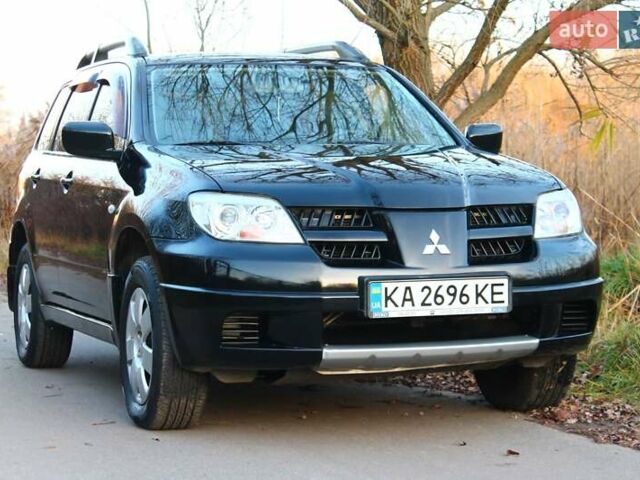 Черный Мицубиси Аутлендер, объемом двигателя 2 л и пробегом 190 тыс. км за 6900 $, фото 18 на Automoto.ua