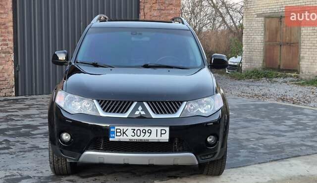 Чорний Міцубісі Аутлендер, об'ємом двигуна 2.4 л та пробігом 230 тис. км за 9700 $, фото 2 на Automoto.ua