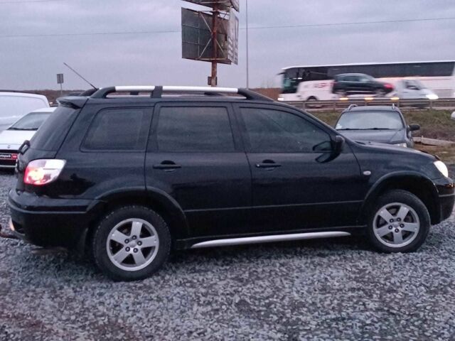 Черный Мицубиси Аутлендер, объемом двигателя 2 л и пробегом 271 тыс. км за 6940 $, фото 9 на Automoto.ua