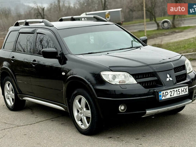 Черный Мицубиси Аутлендер, объемом двигателя 2.4 л и пробегом 245 тыс. км за 6500 $, фото 5 на Automoto.ua