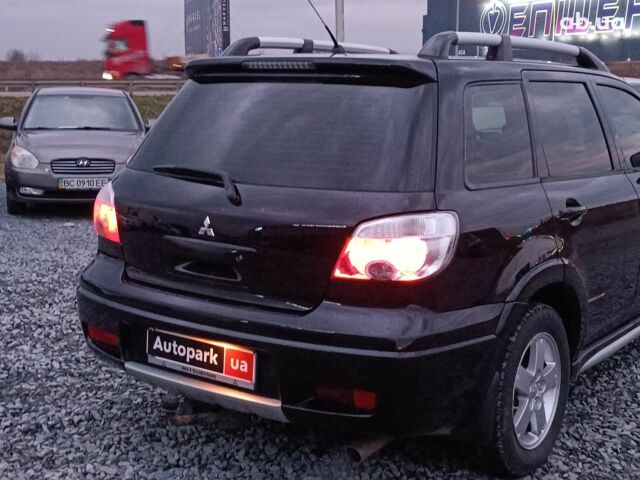 Черный Мицубиси Аутлендер, объемом двигателя 2 л и пробегом 271 тыс. км за 6940 $, фото 7 на Automoto.ua