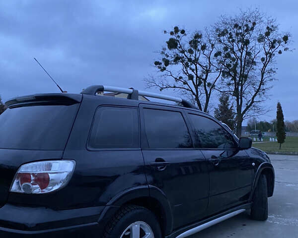 Чорний Міцубісі Аутлендер, об'ємом двигуна 2 л та пробігом 271 тис. км за 6799 $, фото 5 на Automoto.ua