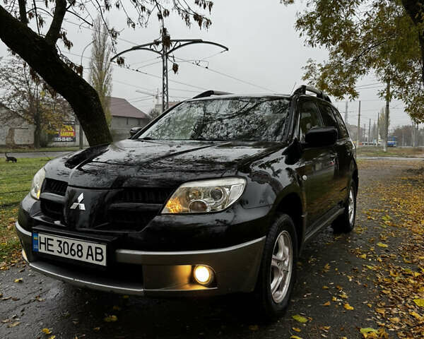 Чорний Міцубісі Аутлендер, об'ємом двигуна 2 л та пробігом 254 тис. км за 7499 $, фото 2 на Automoto.ua