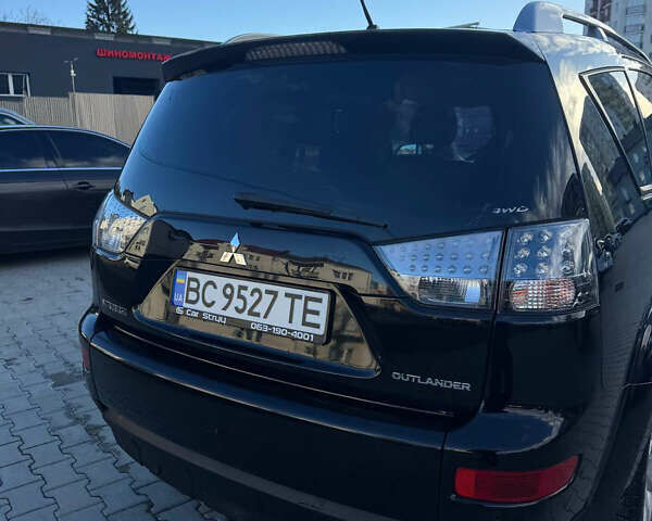 Черный Мицубиси Аутлендер, объемом двигателя 1.97 л и пробегом 202 тыс. км за 9700 $, фото 2 на Automoto.ua