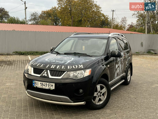 Черный Мицубиси Аутлендер, объемом двигателя 2.4 л и пробегом 230 тыс. км за 6650 $, фото 1 на Automoto.ua
