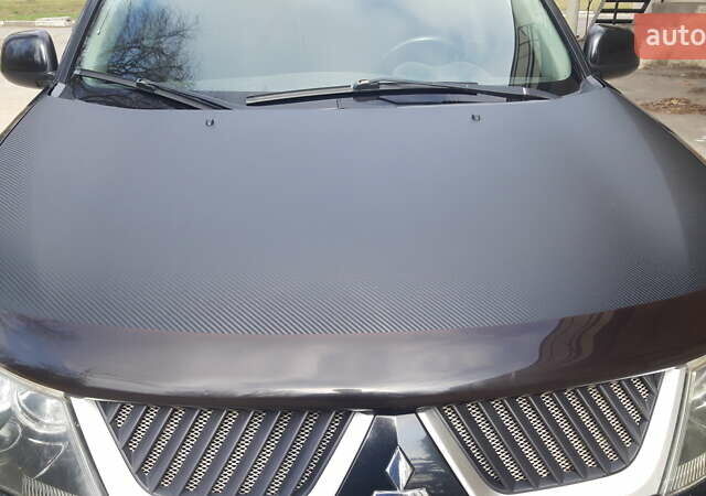 Чорний Міцубісі Аутлендер, об'ємом двигуна 2.36 л та пробігом 277 тис. км за 8500 $, фото 1 на Automoto.ua