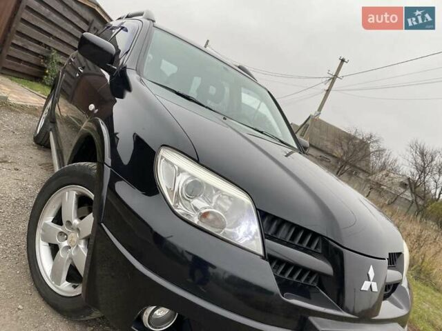Черный Мицубиси Аутлендер, объемом двигателя 2.4 л и пробегом 178 тыс. км за 6900 $, фото 14 на Automoto.ua