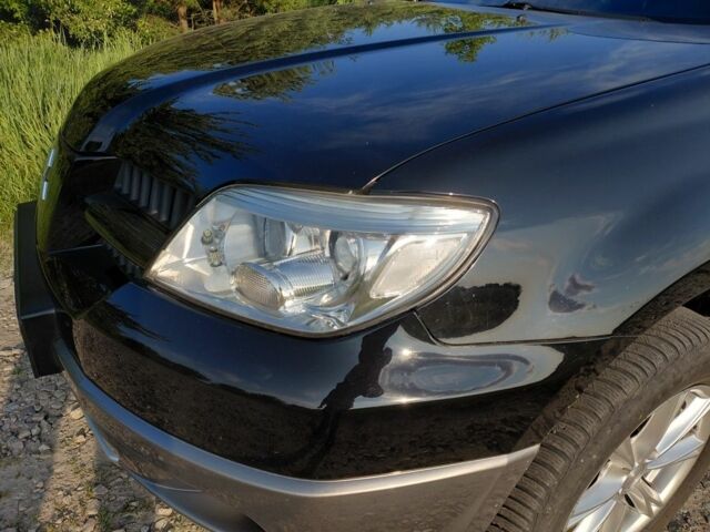 Черный Мицубиси Аутлендер, объемом двигателя 2 л и пробегом 143 тыс. км за 7800 $, фото 2 на Automoto.ua