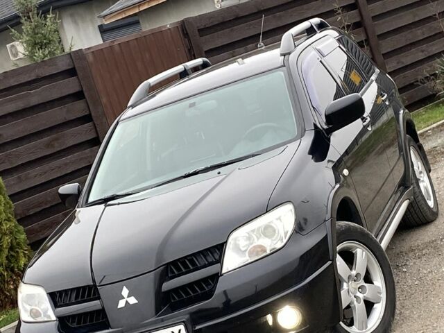 Черный Мицубиси Аутлендер, объемом двигателя 2.4 л и пробегом 178 тыс. км за 6900 $, фото 8 на Automoto.ua