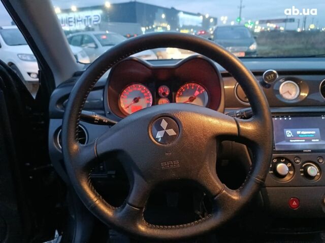 Черный Мицубиси Аутлендер, объемом двигателя 2 л и пробегом 271 тыс. км за 6940 $, фото 24 на Automoto.ua