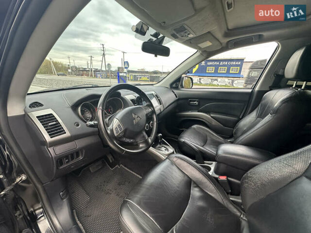 Чорний Міцубісі Аутлендер, об'ємом двигуна 2.4 л та пробігом 218 тис. км за 10000 $, фото 5 на Automoto.ua