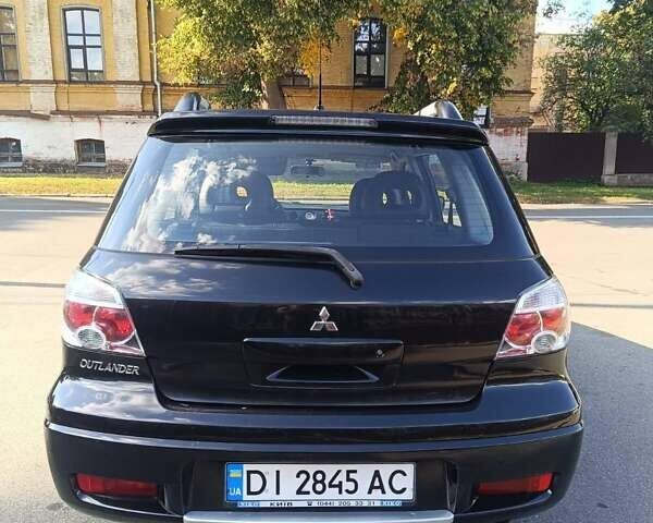 Чорний Міцубісі Аутлендер, об'ємом двигуна 2.38 л та пробігом 141 тис. км за 8200 $, фото 4 на Automoto.ua