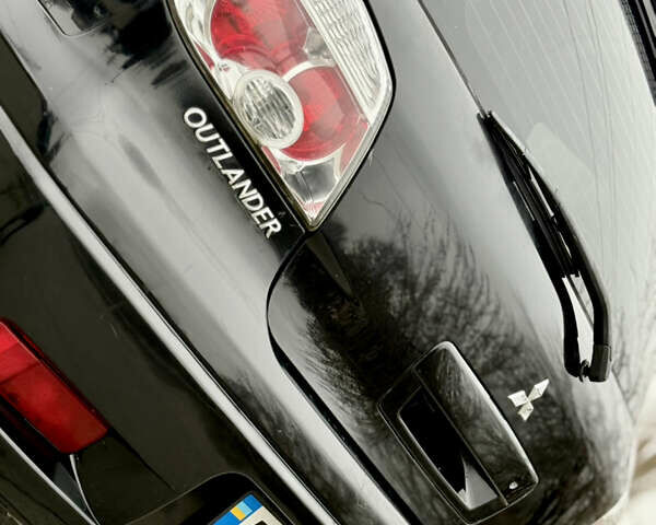 Черный Мицубиси Аутлендер, объемом двигателя 2.4 л и пробегом 245 тыс. км за 6500 $, фото 8 на Automoto.ua