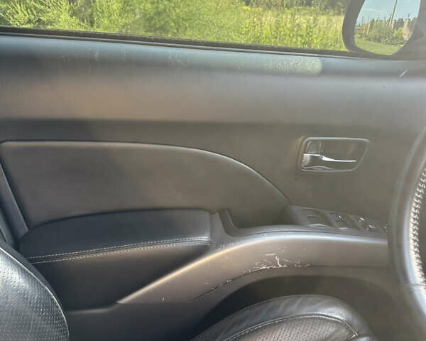 Черный Мицубиси Аутлендер, объемом двигателя 2.36 л и пробегом 240 тыс. км за 9599 $, фото 30 на Automoto.ua