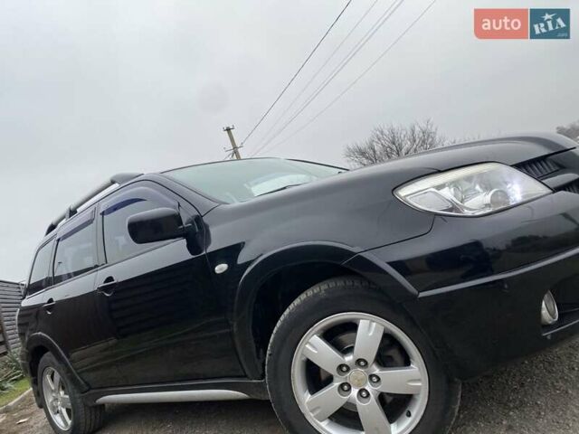Черный Мицубиси Аутлендер, объемом двигателя 2.4 л и пробегом 178 тыс. км за 6900 $, фото 4 на Automoto.ua