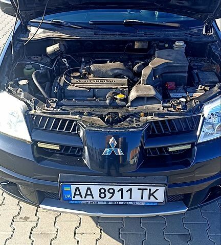 Чорний Міцубісі Аутлендер, об'ємом двигуна 2 л та пробігом 364 тис. км за 5900 $, фото 7 на Automoto.ua