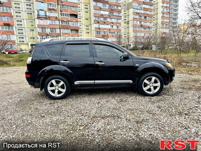 Черный Мицубиси Аутлендер, объемом двигателя 2.4 л и пробегом 229 тыс. км за 9790 $, фото 7 на Automoto.ua