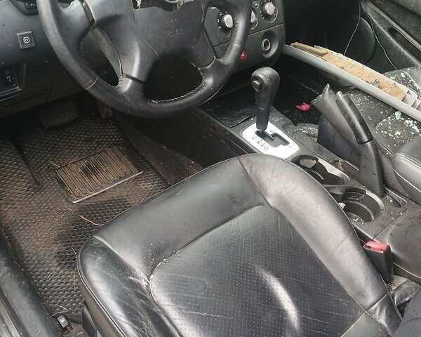 Черный Мицубиси Аутлендер, объемом двигателя 2.38 л и пробегом 270 тыс. км за 1700 $, фото 3 на Automoto.ua