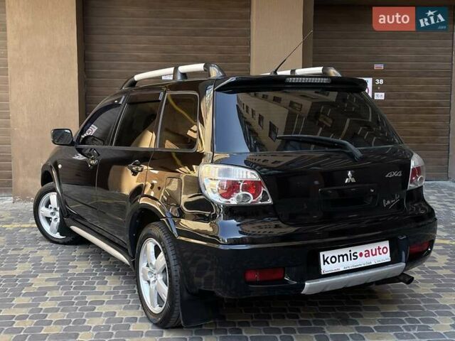 Черный Мицубиси Аутлендер, объемом двигателя 2 л и пробегом 270 тыс. км за 7199 $, фото 17 на Automoto.ua