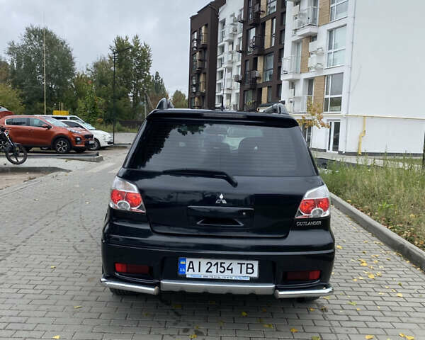 Чорний Міцубісі Аутлендер, об'ємом двигуна 2.38 л та пробігом 252 тис. км за 7200 $, фото 5 на Automoto.ua