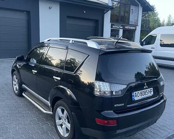 Черный Мицубиси Аутлендер, объемом двигателя 2.4 л и пробегом 290 тыс. км за 9500 $, фото 11 на Automoto.ua