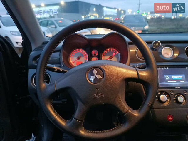 Чорний Міцубісі Аутлендер, об'ємом двигуна 2 л та пробігом 271 тис. км за 6940 $, фото 24 на Automoto.ua